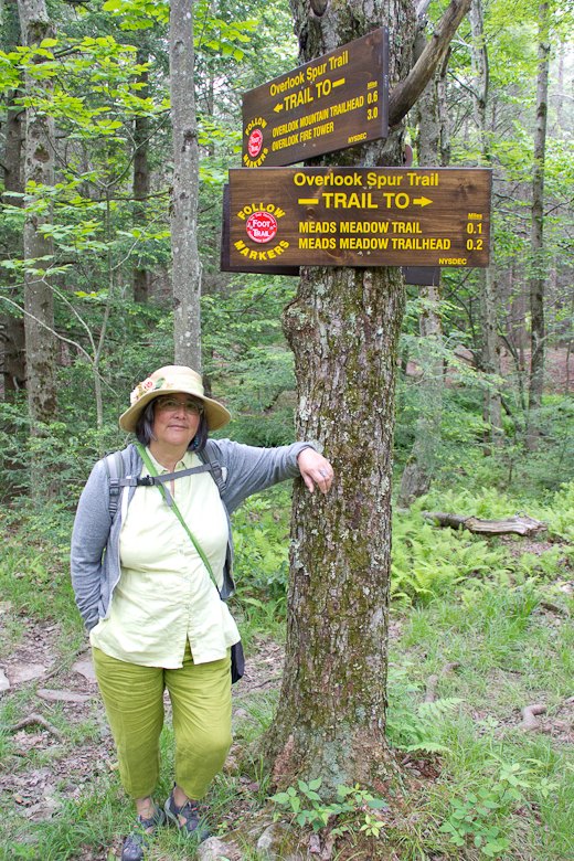 Aileen Fitzke at Trailhead signs